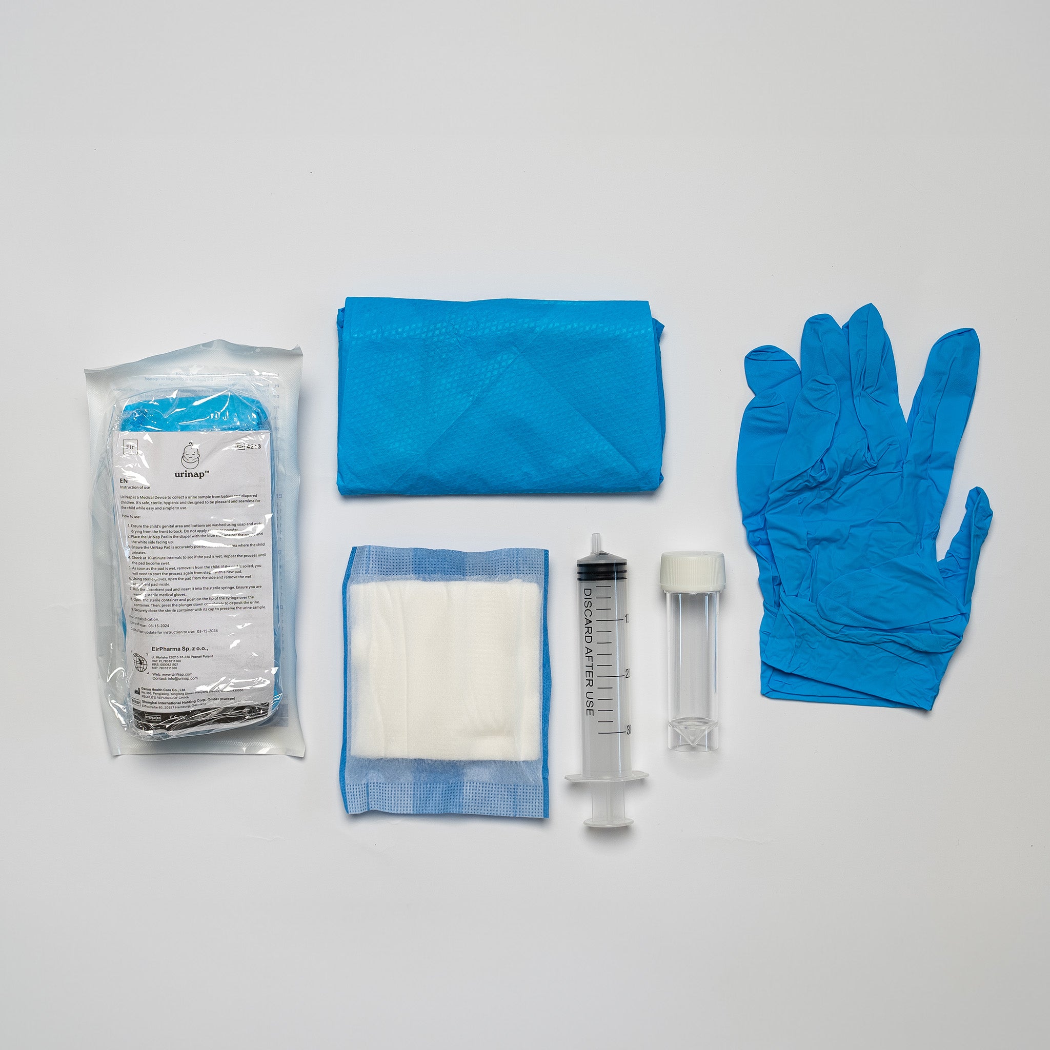 Baby urine collection pack contents: sealed kit, blue wrapper, gloves, collection pad, syringe, and sterile container on white background.